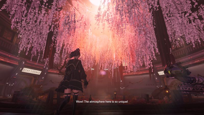 EVE, the protagonist of Stellar Blade, wearing a schoolgirl uniform and black thigh-highs, looks up at a ceiling full of hanging pink flowers. She says, “Wow! The atmosphere here is so unique!”